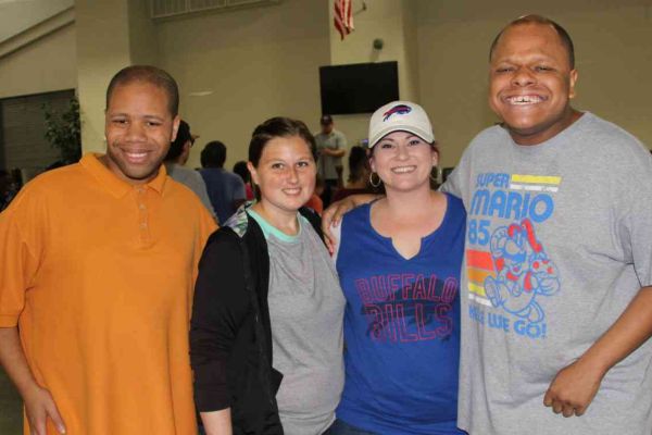 four pathfinder teens standing side by side for a photo at a pathfinder event
