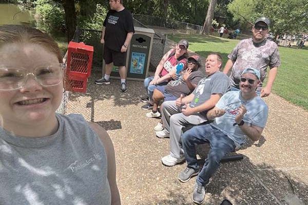 a group of pathfinders sitting at the zoo